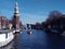 Romantic Dutch canals of Amsterdam on a gray day of winter haze