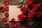 Romantic elegance top view of red roses with a blank card