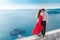 Romantic embracing couple beside blue sea. Love. Fashion girl in