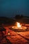 Romantic evening in glamping desert camp in Sahara, Morocco with campfire.