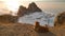 Romantic frame-a lonely homeless dog on the shore of Olkhon island. Panoramic view of Shamanka rock from Cape Burhan. Beautiful