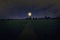 Romantic full moon over green rice field