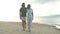 Romantic getaways are always good ideas. 4k video footage of a happy young couple going for a relaxing walk along the