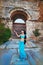 Romantic girl in east princess oriental arabic style costume posing on ancient ruins background