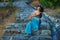 Romantic girl in east princess oriental arabic style costume posing on ancient ruins background