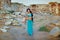 Romantic girl in east princess oriental arabic style costume posing on ancient ruins background