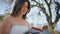 Romantic girl holding book sitting nature closeup. Tranquil woman enjoy reading