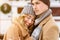 Romantic Girl Leaning On Her Boyfriend`s Chest During Winter Date Outdoors