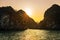 Romantic Halong bay sunset over limestone rocks, Vietnam