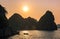 Romantic Halong bay sunset over limestone rocks, Vietnam