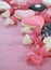Romantic heart shape pink, white and black cookies and candy