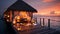 Romantic Hotels and Resorts on Maldives straw cabin evening blurred light blue sea water