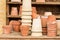 Romantic idyllic plant table in the garden with old retro terracotta flower pot pots