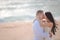 Romantic kissing loving couple on the beach