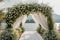 Romantic lakeside affair wedding ceremony adorned with white flowers