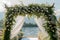 Romantic lakeside affair wedding ceremony adorned with white flowers