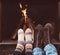 Romantic legs of a couple in socks in front of fireplace at winter season at home