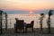 Romantic little table on the seashore, with candles.