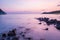 Romantic long exposure sea water beach during sunset