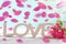 Romantic love background with falling rose petals