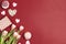 Romantic love background with tasty cupcakes and pink tulips. Copy space, overhead shot