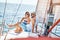 Romantic lovers spending time together and relaxing on yacht