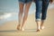 romantic lovers young happy couple holding hands walking on sand