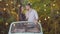 Romantic loving couple standing in retro car and talking. Portrait of carefree Caucasian man and woman dating outdoors