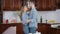 Romantic loving millennial couple dancing in kitchen at home. Slow dance of affectionate Caucasian young man and woman