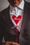 Romantic man in suit with heart, inscription love