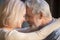 Romantic mature couple in love, wife and husband touching foreheads