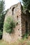 Romantic medieval ruins covered by green plants, abandoned city Mystras, Greece