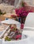 Romantic mediterraen vacation on a rooftop over the sea in Santorini with Bougainvillea flower
