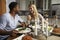 Romantic mixed race couple eating evening meal in kitchen