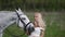 romantic mood at wedding day, beautiful woman in white dress and calm cute equine