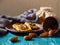 Romantic morning still life, in a rustic style with cookies, a glass jar of honey and scattered dates on a turquoise wooden