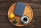 Romantic morning. Wooden tray with book, rose, cup of coffee, on wooden background