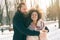 Romantic multiethnic couple in love hugging on the street