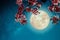 Romantic night scene - Beautiful cherry blossom sakura flowers in night skies with full moon.