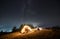 Romantic nightly camping in mountains under starfull sky.