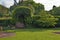 Romantic nook with wood bench and hedge