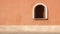 Romantic Orange Wall With Arched Window In Spanish Palladian Architecture