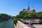 Romantic paris. Accordion player near Notre-Dame Cathedral at sunny day.