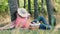 Romantic picnic time. Happy young couple kissing. Man laying on her hands. Outdoors in the park