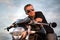 Romantic portrait handsome biker man in sunglasses