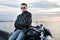 Romantic portrait handsome biker man in sunglasses