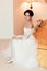 Romantic rich happy girl in bridal dress smiling have final preparation for wedding