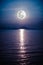 Romantic scenic with full moon on sea to night. Reflection of mo