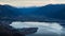 Romantic scenic view of the sunrise at Iseo Lake with alps in the background