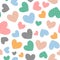 Romantic seamless pattern with cute colored hearts. Drawn by hand.